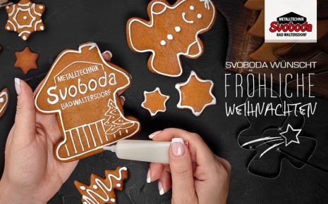 Lebkuchenkeks in Hausform mit Svoboda-Logo als Zuckerguss und Weihnachtswünsche